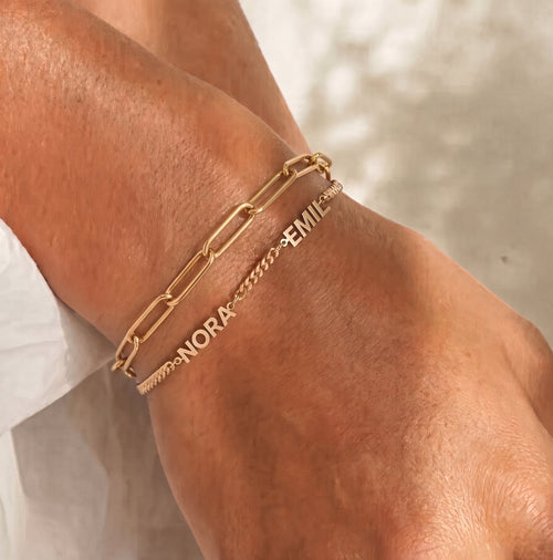 Fine Paperclip Chain Bracelet layered with a gold-tone Personalised Name Bracelet