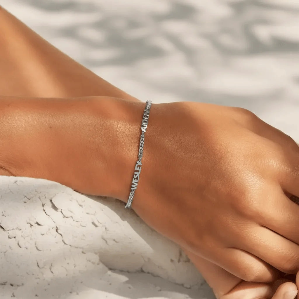Personalised silver-tone name bracelet close-up