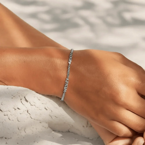 Personalised silver-tone name bracelet close-up